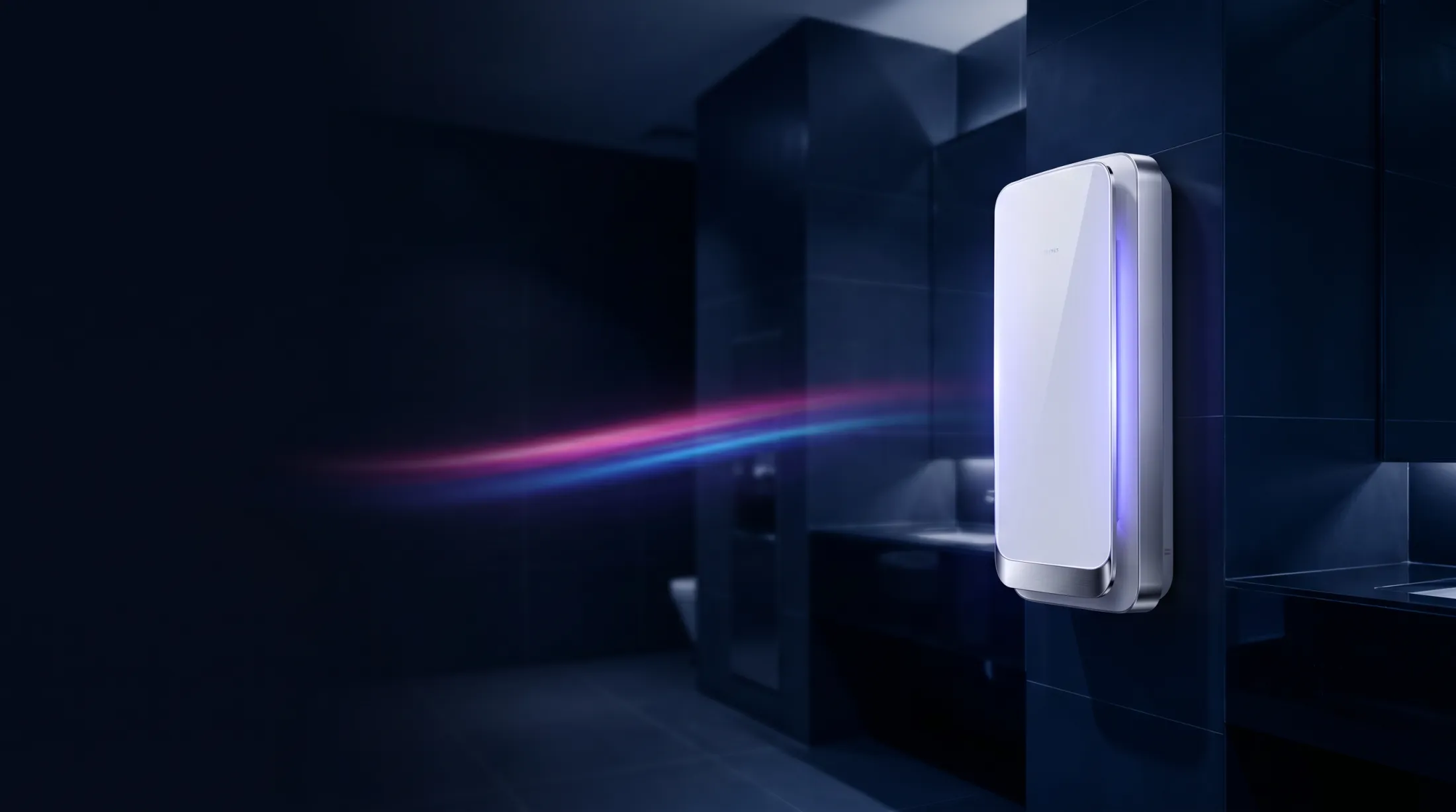A slim wall-mounted air sterilisation and purification unit in a commercial washroom