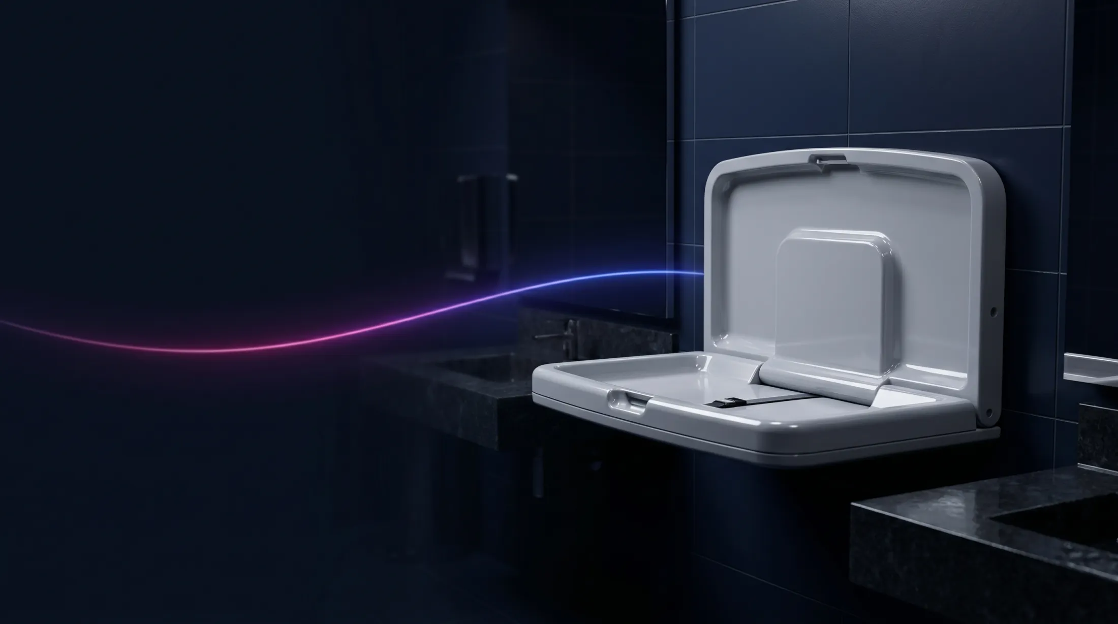 A wall-mounted fold-down baby changing unit in a family washroom